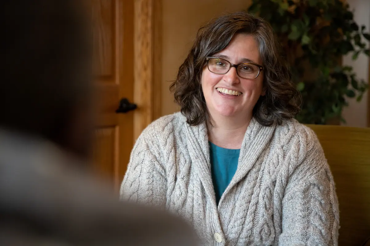 Female provider smiling while talking to a patient